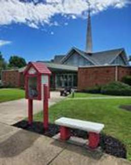 A bench in front of a building
Description automatically generated with low confidence